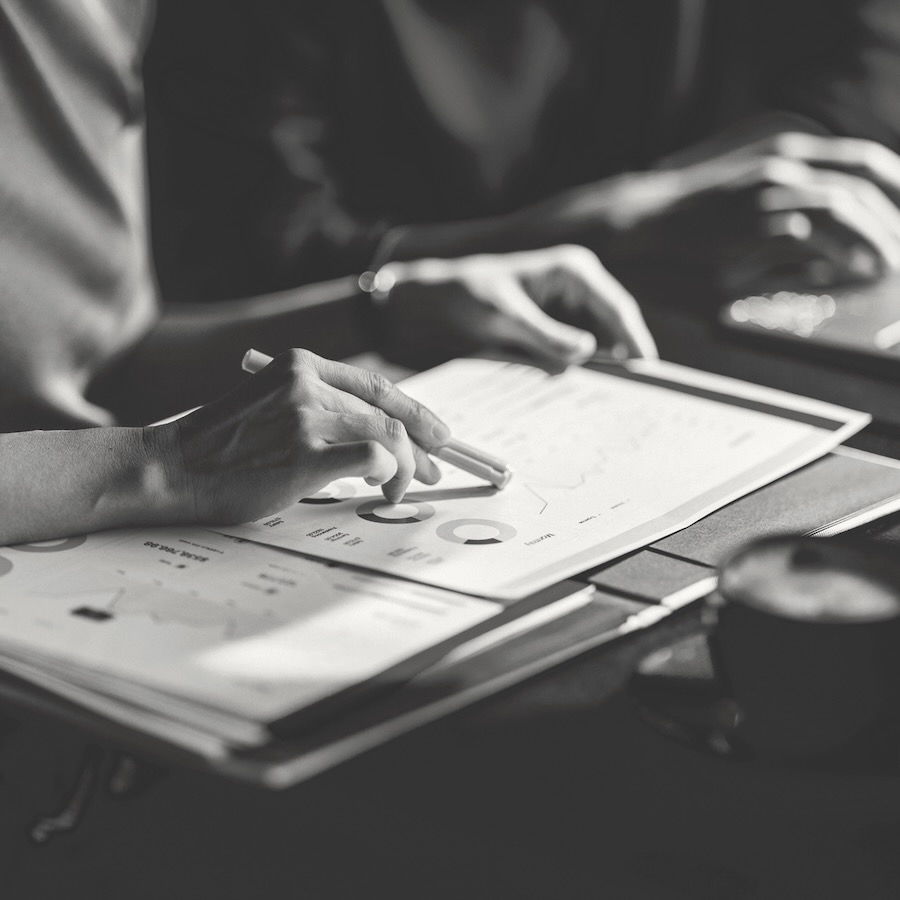 Fractional CFO - sidebar - closeup of hands working with reports