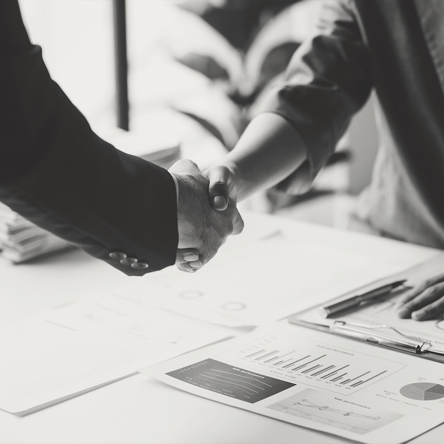 M&A Advisory - sidebar - A handshake over financial documents